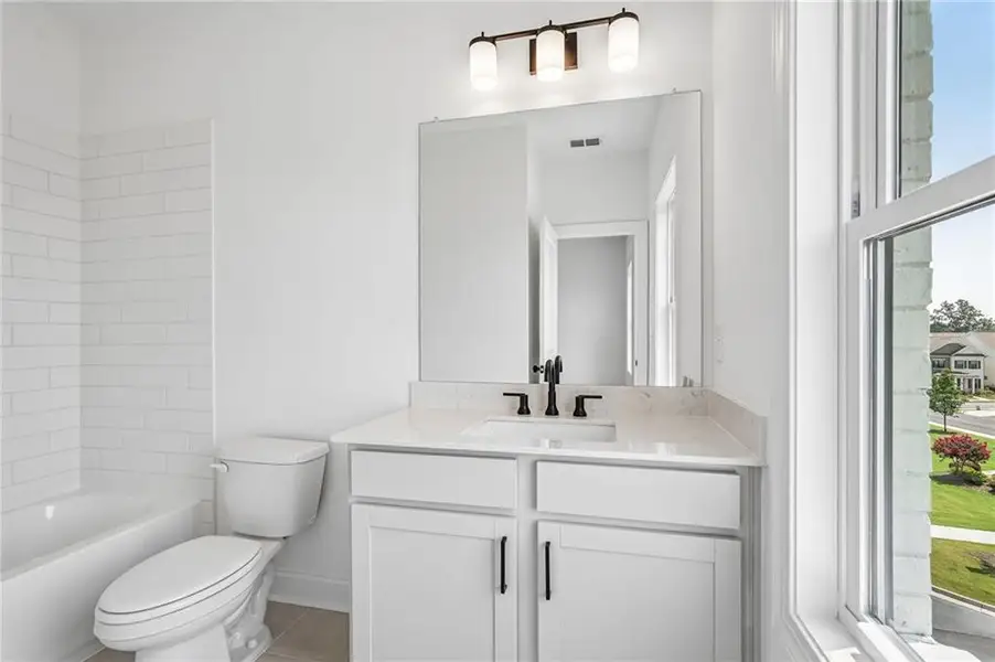 Furnished interior view inside a new home in Millcroft Townhomes, Buford (Image 10). Furnished interior view inside a new home in Millcroft Townhomes, Buford (Image 10).