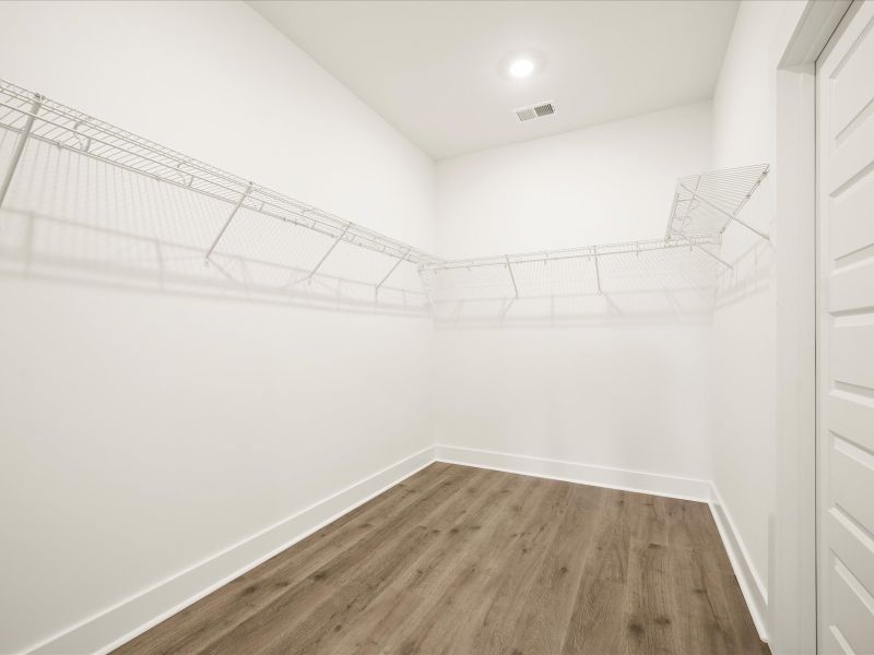 Spacious, unfurnished interior of a new home in The Coves at Lakes of Cane Bay, Summerville (Image 22).