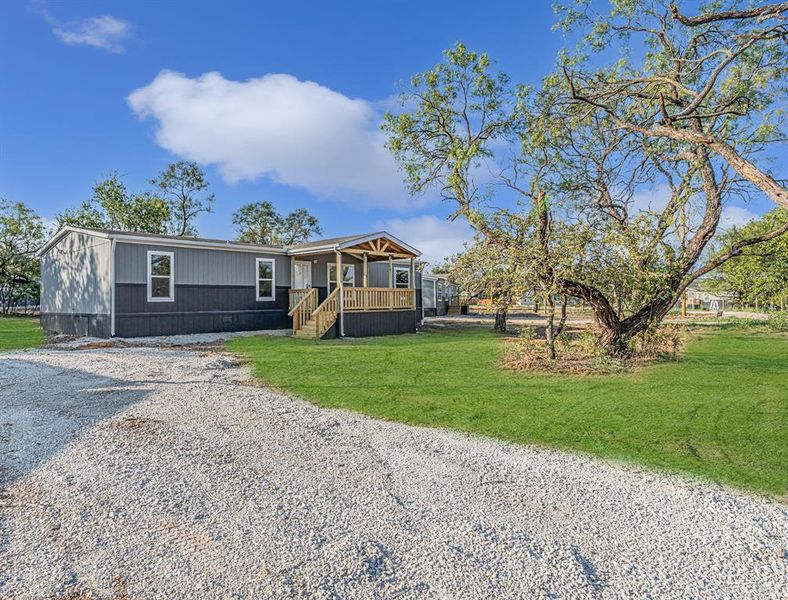 Front exterior of a new home in , Bridgeport, TX, highlighting curb appeal (Image 21). Front exterior of a new home in , Bridgeport, TX, highlighting curb appeal (Image 21).