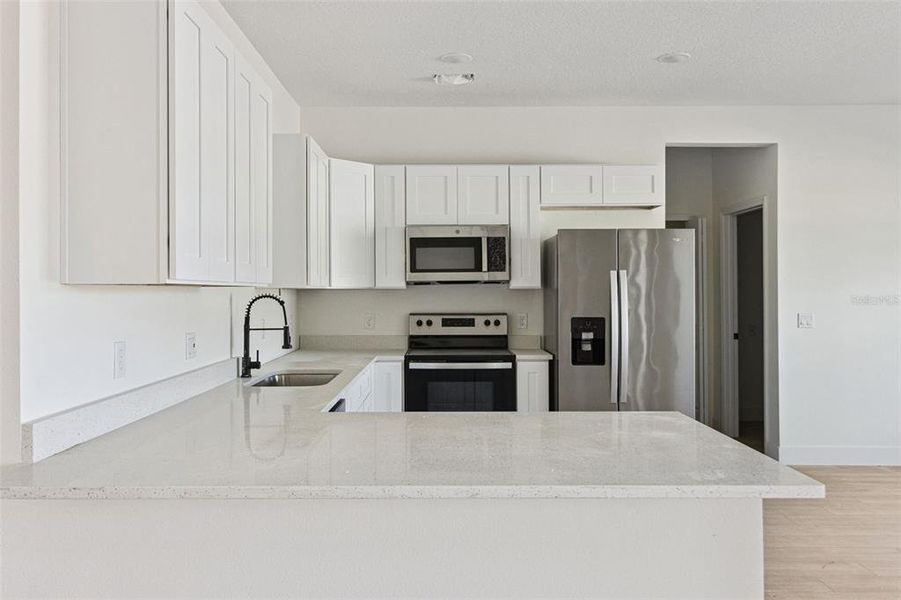 Furnished interior view inside a new home in , Kissimmee (Image 5).