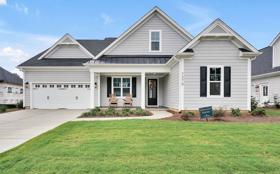 Exterior details and patio area of a home in Brunswick Forest, Leland (Image 1).
