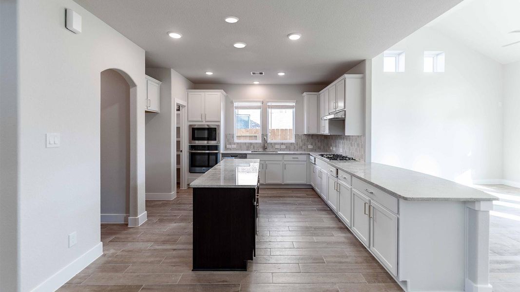 Furnished interior view inside a new home in Sunterra, Katy (Image 6).