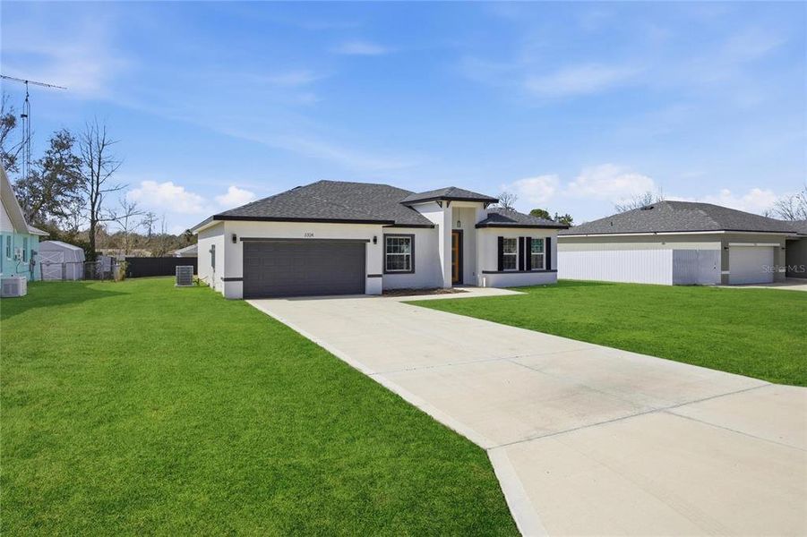 Front exterior of a new home in , Ocala, FL, highlighting curb appeal (Image 28). Front exterior of a new home in , Ocala, FL, highlighting curb appeal (Image 28).