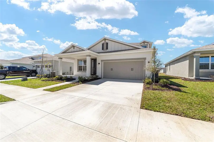 Front exterior of a new home in Calesa Township, Ocala, FL, highlighting curb appeal (Image 20).