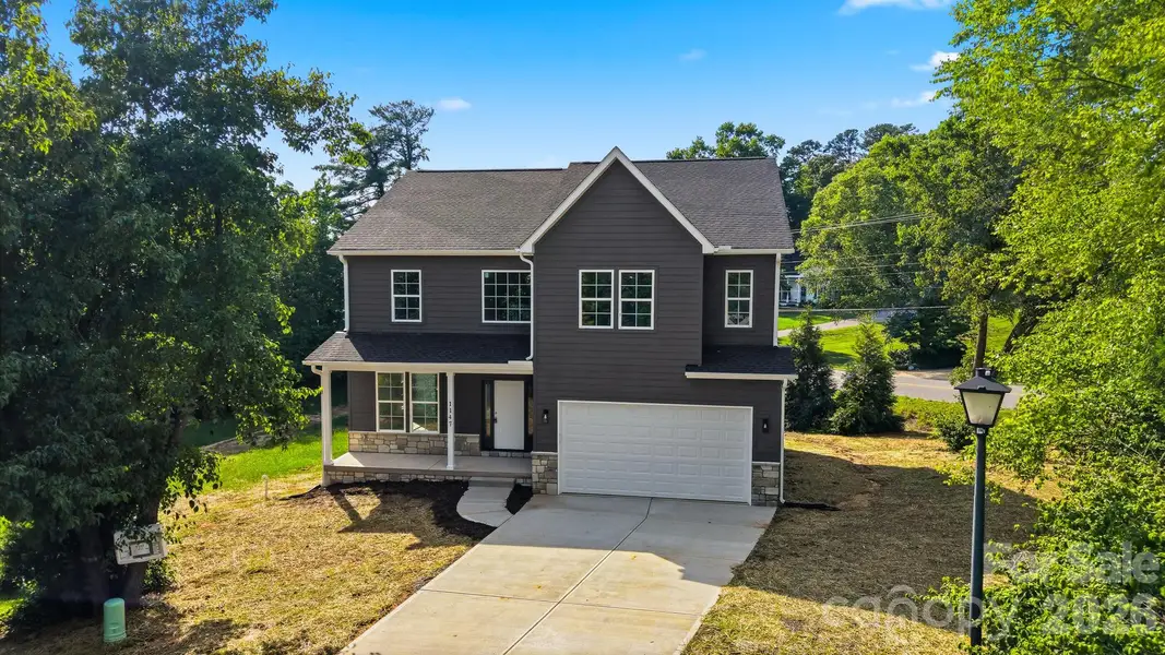 Front exterior of a new home in , Hickory, NC, highlighting curb appeal (Image 22).