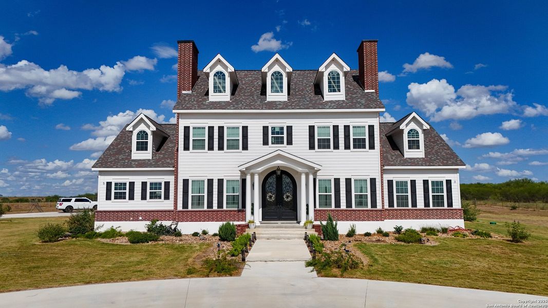 Front exterior of a new home in , Kenedy, TX, highlighting curb appeal (Image 2).