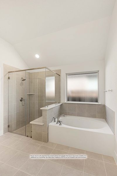 Bathroom with glass-enclosed walk-in shower, soaking tub, and beige tile walls and floors Bathroom with glass-enclosed walk-in shower, soaking tub, and beige tile walls and floors