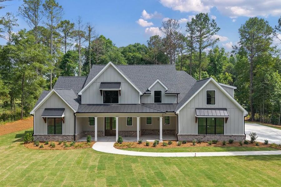 Front exterior of a new home in , Carrollton, GA, highlighting curb appeal (Image 24).