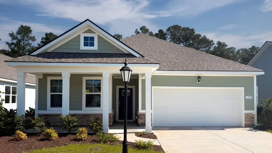 Representative exterior photo of a completed home built from the Aria by D.R. Horton in Brunswick Plantation, Ash, NC (Image 2). Representative exterior photo of a completed home built from the Aria by D.R. Horton in Brunswick Plantation, Ash, NC (Image 2).