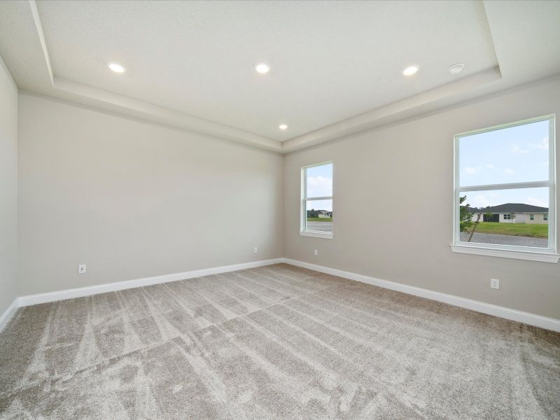 Primary Bedroom in the Onyx floorplan at 6383 NW Sweetwood Drive in Brystol at Wylder