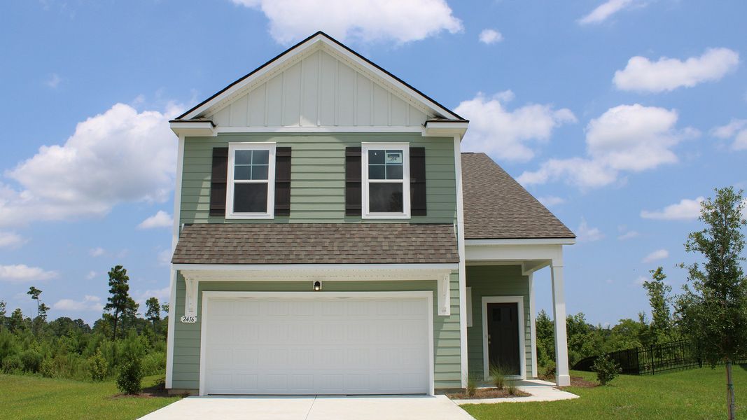 Front exterior of a new home in Auberon Woods, Conway, SC, highlighting curb appeal (Image 1).