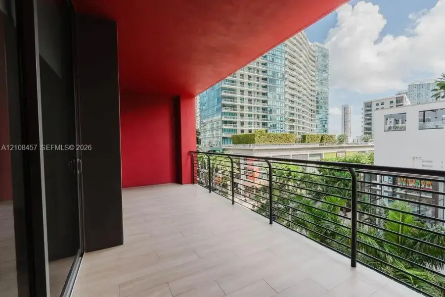 Covered balcony featuring tile flooring and a horizontal rail system Covered balcony featuring tile flooring and a horizontal rail system