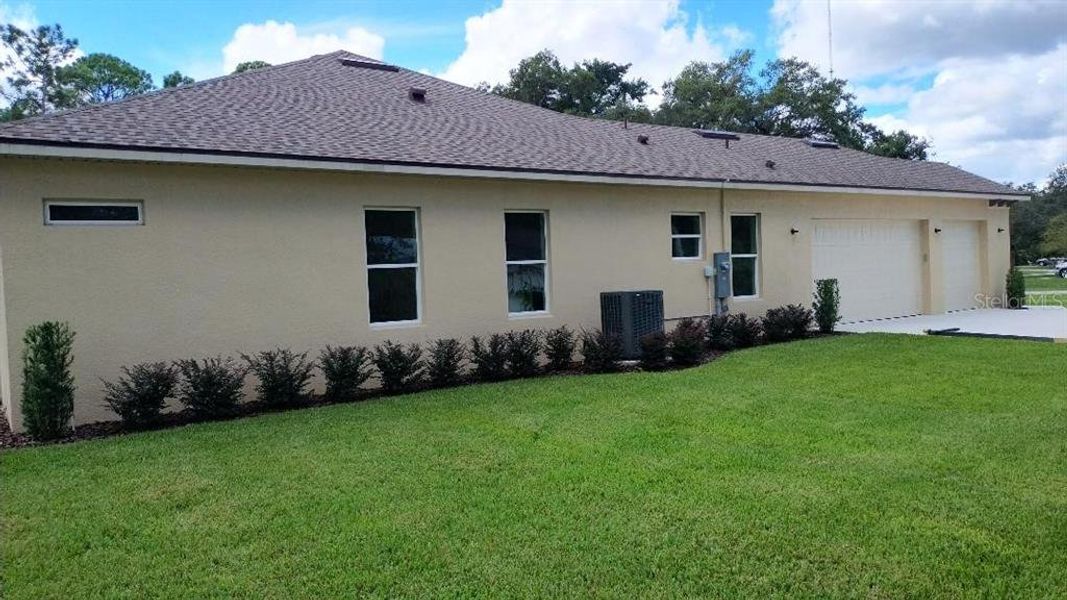 Front exterior of a new home in , Orange City, FL, highlighting curb appeal (Image 2).