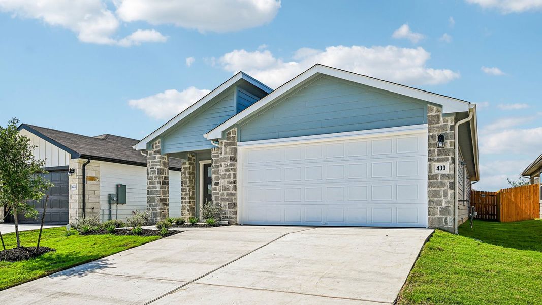 Front exterior of a new home in Southgrove, Kyle, TX, highlighting curb appeal (Image 2).