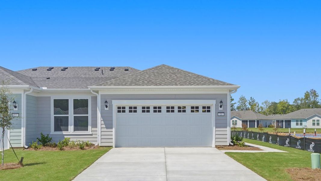 Front exterior of a new home in Sun City Hilton Head, Bluffton, SC, highlighting curb appeal (Image 26).