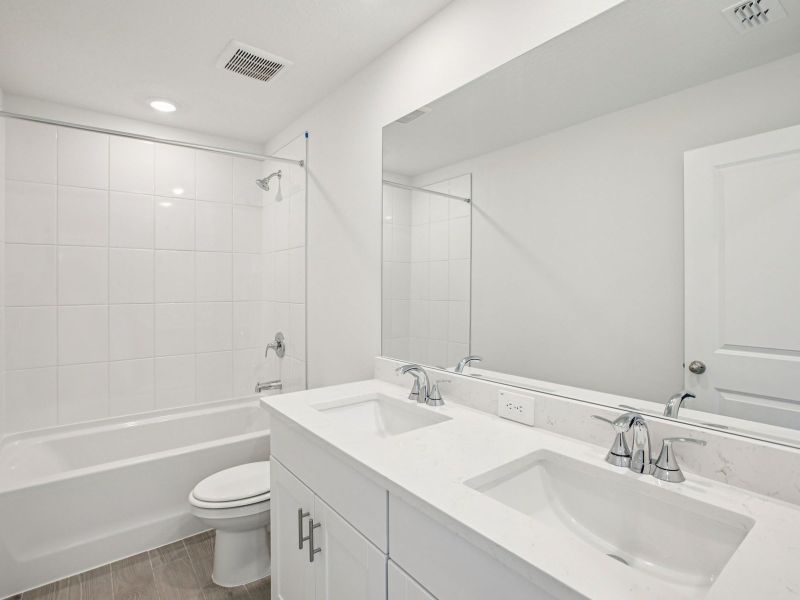 Furnished interior view inside a new home in The Grove at Stuart Crossing - Classic Series, Bartow (Image 6).