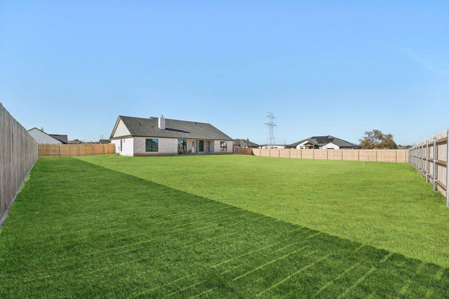 View of fenced backyard