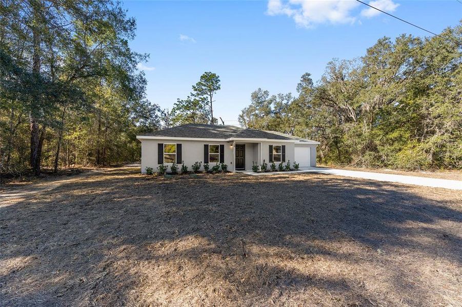 Front exterior of a new home in , Ocala, FL, highlighting curb appeal (Image 20).
