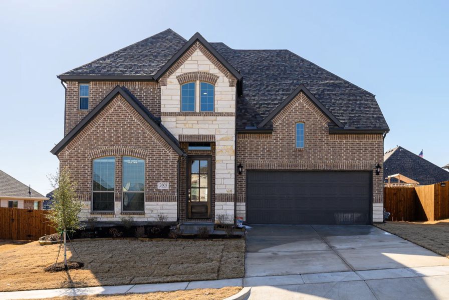 Front exterior of a home in the Meadow Vista community, located in Anna, TX (Image 9).
