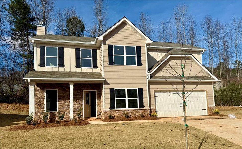 Front exterior of a new home in , Villa Rica, GA, highlighting curb appeal (Image 1). Front exterior of a new home in , Villa Rica, GA, highlighting curb appeal (Image 1).