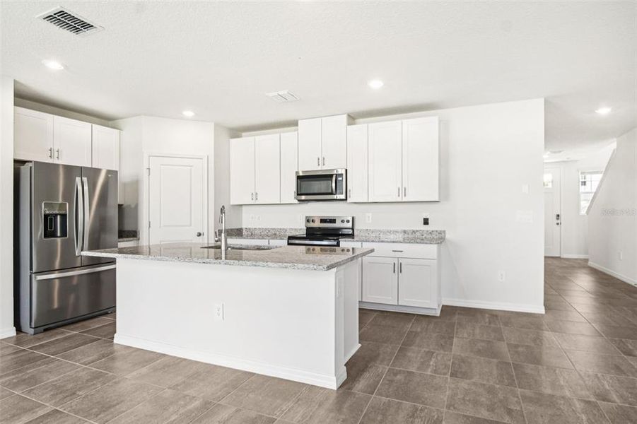 Furnished interior view inside a new home in Two Rivers - Premier Series, Zephyrhills (Image 5). Furnished interior view inside a new home in Two Rivers - Premier Series, Zephyrhills (Image 5).