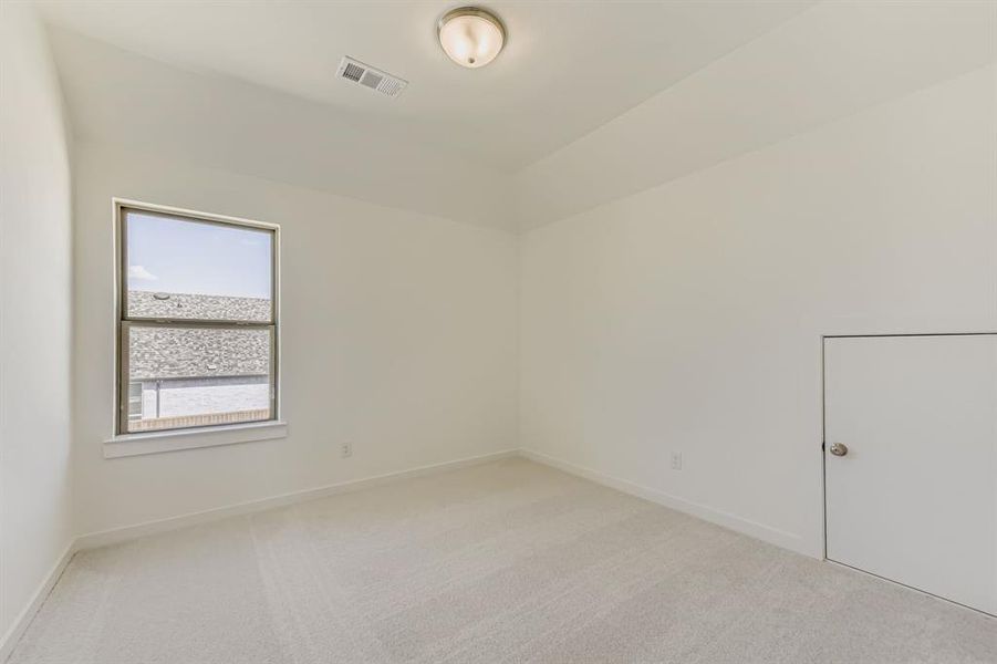 Unfurnished room featuring light carpet and baseboards Unfurnished room featuring light carpet and baseboards