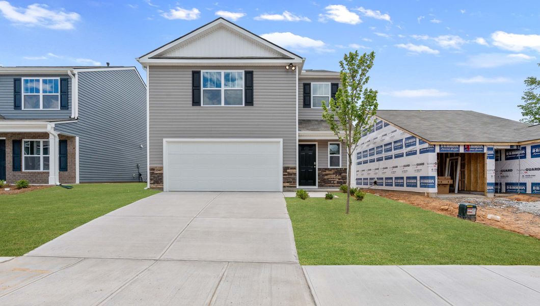 Front exterior of a new home in Harper Ridge, Roebuck, SC, highlighting curb appeal (Image 1).