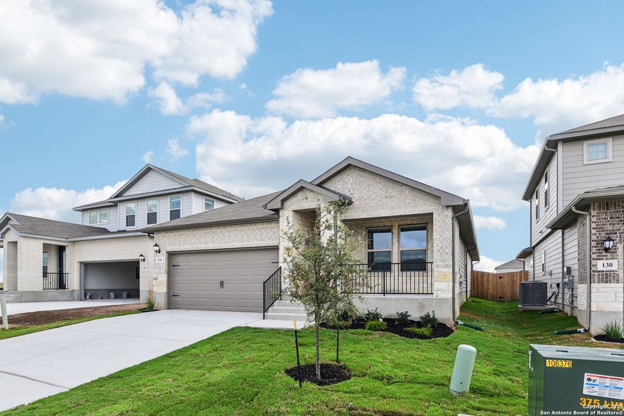 Front exterior of a new home in Legendary Trails - Premier Series, Cibolo, TX, highlighting curb appeal (Image 20). Front exterior of a new home in Legendary Trails - Premier Series, Cibolo, TX, highlighting curb appeal (Image 20).