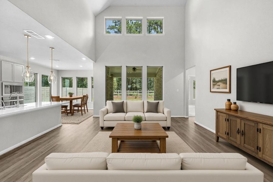 2-story ceilings in the functional family room. Virtually staged.