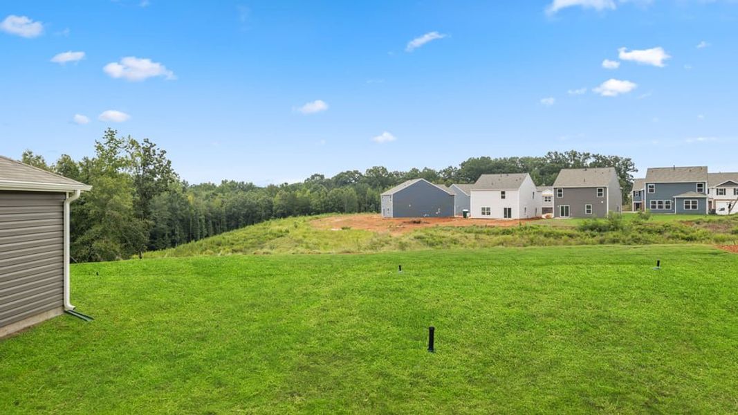 Exterior details and patio area of a home in Treemont Commons, Wellford (Image 23).
