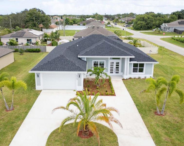 Front exterior of a new home in , Port St. Lucie, FL, highlighting curb appeal (Image 1). Front exterior of a new home in , Port St. Lucie, FL, highlighting curb appeal (Image 1).