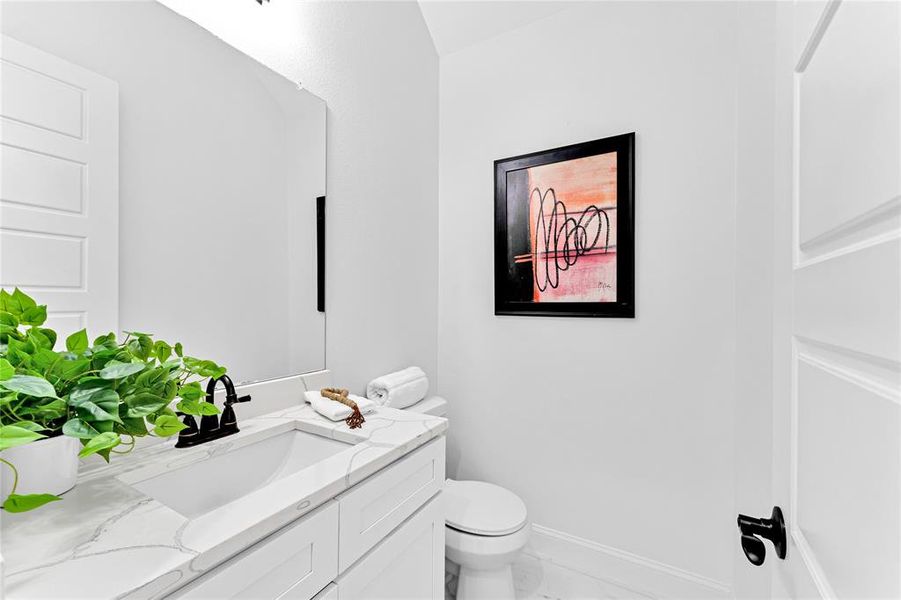 Bathroom with vanity and toilet