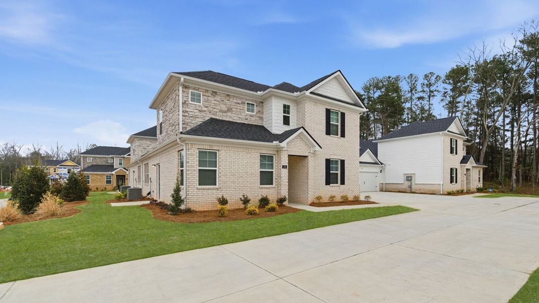 Front exterior of a new home in Independence Villas and Townhomes, Loganville, GA, highlighting curb appeal (Image 2).
