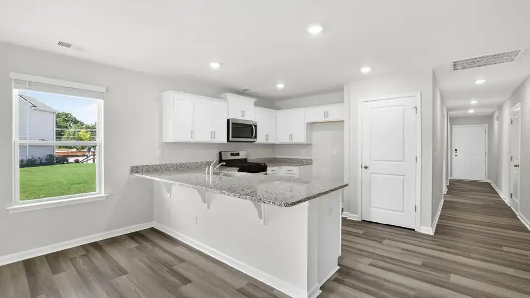 Furnished interior view inside a new home in Village Grove, Greenville (Image 8).