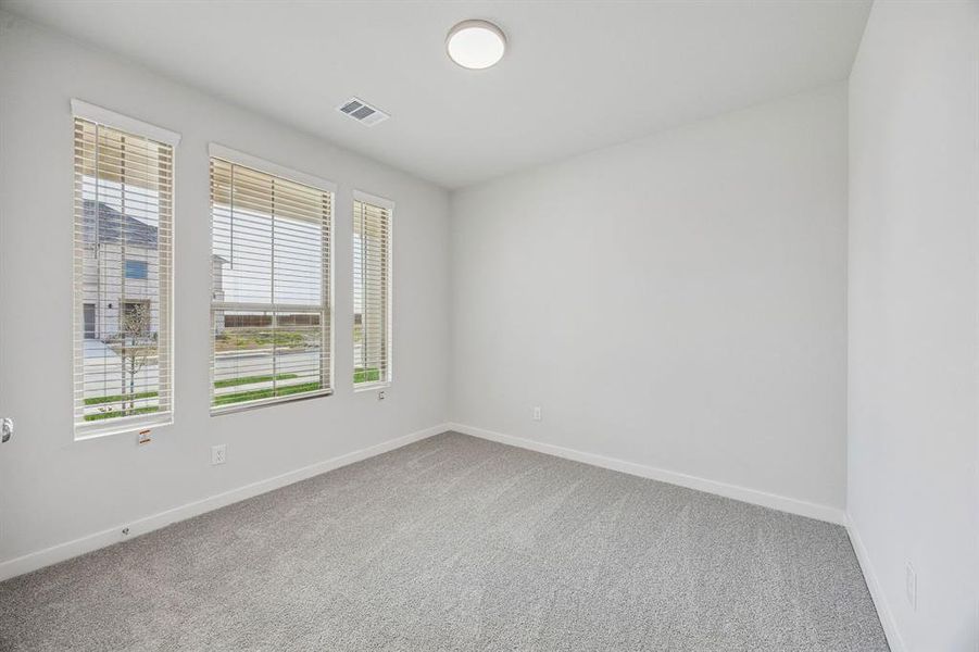 Bedroom in the Stanley II home plan by Trophy Signature Homes – REPRESENTATIVE PHOTO