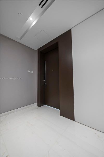Spacious, unfurnished interior of a new home in Aston Martin Residences, Miami (Image 29).