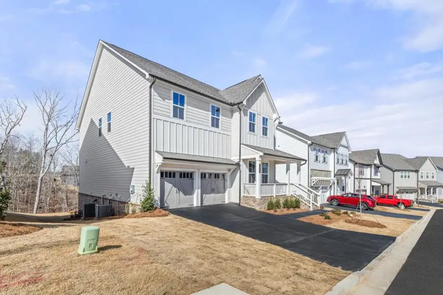 Exterior details and patio area of a home in East Harbor II at Chestatee, Dawsonville (Image 27).