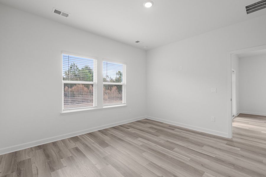 Spacious, unfurnished interior of a new home in Cypress Ridge - The Boardwalk Series, Longs (Image 15).