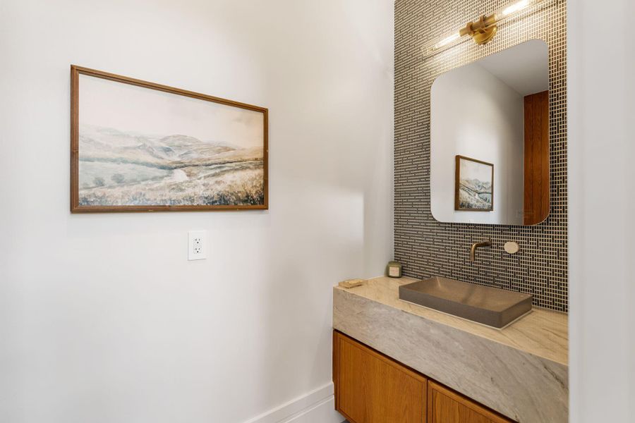 Gorgeous powder bath with sleek finishes.