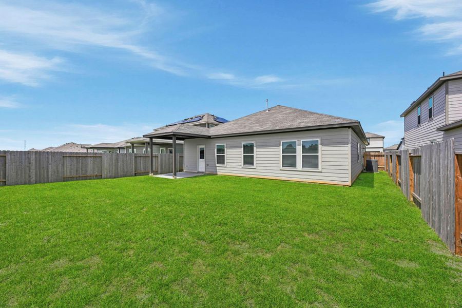 Exterior details and patio area of a home in Paloma at Sanford Farms, Waller (Image 19).