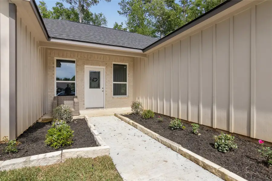 Discover this new home featuring 3 bedrooms and 3 full baths. Enjoy a welcoming entryway with a paved path and vibrant flower beds, boosting curb appeal.