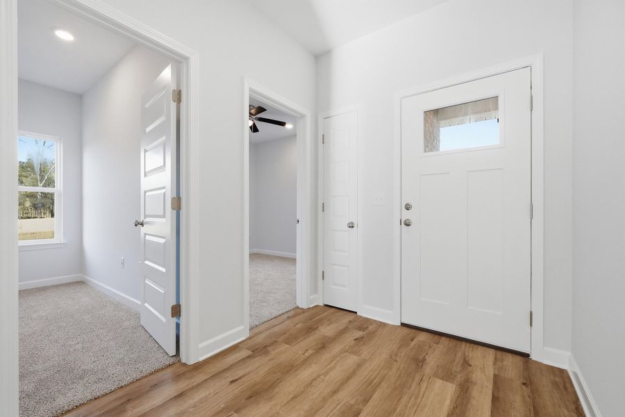 Photos of a similar home. Foyer