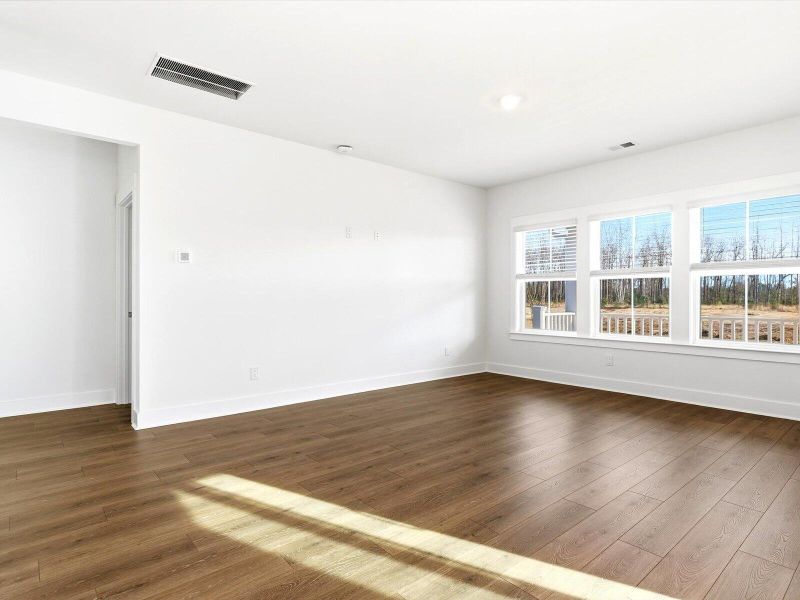 Spacious, unfurnished interior of a new home in The Coves at Lakes of Cane Bay, Summerville (Image 19).
