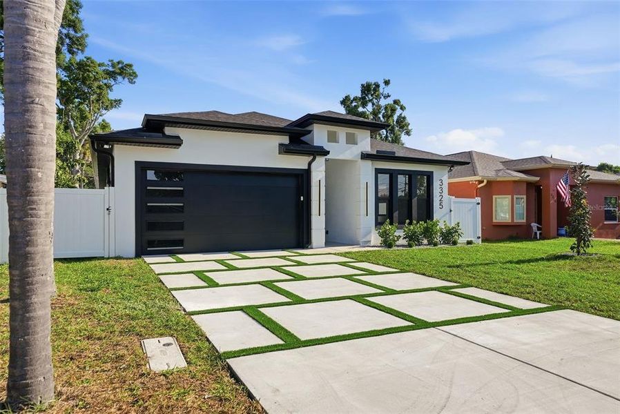 Front exterior of a new home in , St. Petersburg, FL, highlighting curb appeal (Image 26).