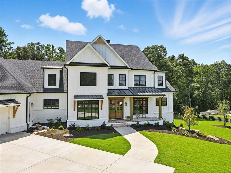 Front exterior of a new home in , Canton, GA, highlighting curb appeal (Image 2).