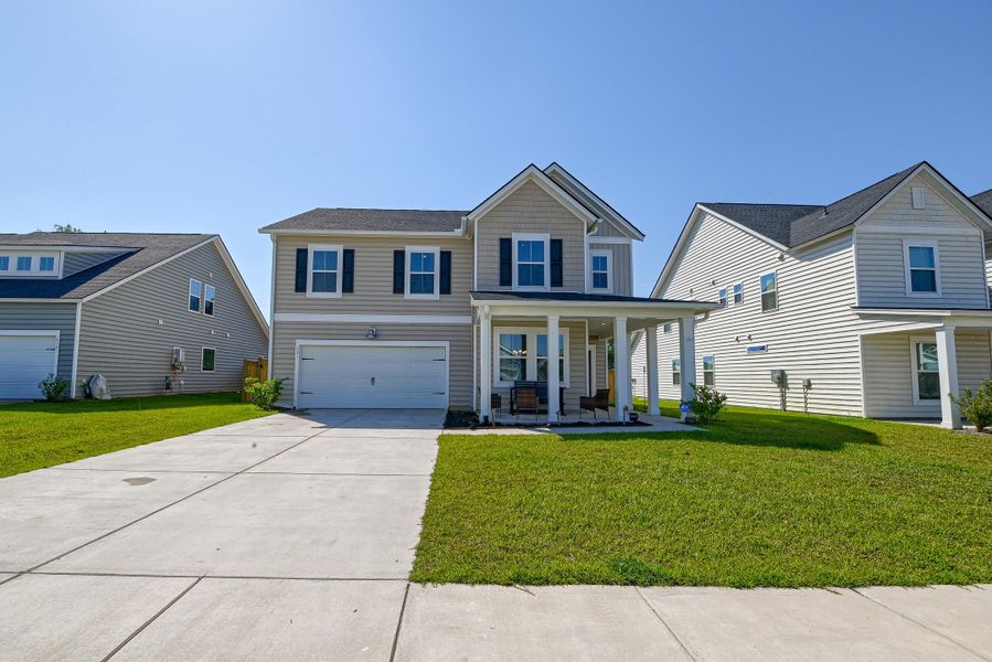 Front exterior of a new home in Heron's Walk at Summers Corner, Summerville, SC, highlighting curb appeal (Image 23).