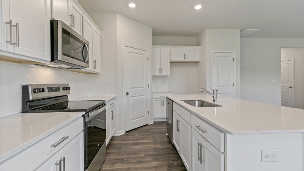 Representative furnished interior of a home built from the DARWIN by D.R. Horton in Honeycutt Oaks, Angier (Image 5). Representative furnished interior of a home built from the DARWIN by D.R. Horton in Honeycutt Oaks, Angier (Image 5).