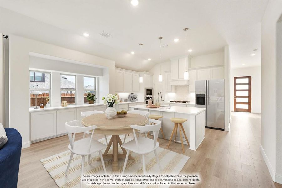 Open-concept kitchen and dining area with white cabinets, center island, stainless appliances, and light wood floors