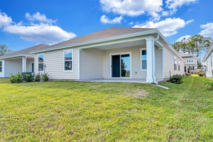 Exterior details and patio area of a home in Whiteview Village, Palm Coast (Image 15).