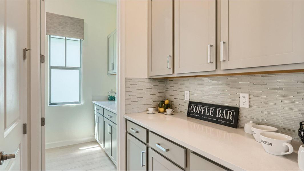 Furnished interior view inside a new home in Tesoro Club, Port St. Lucie (Image 11).